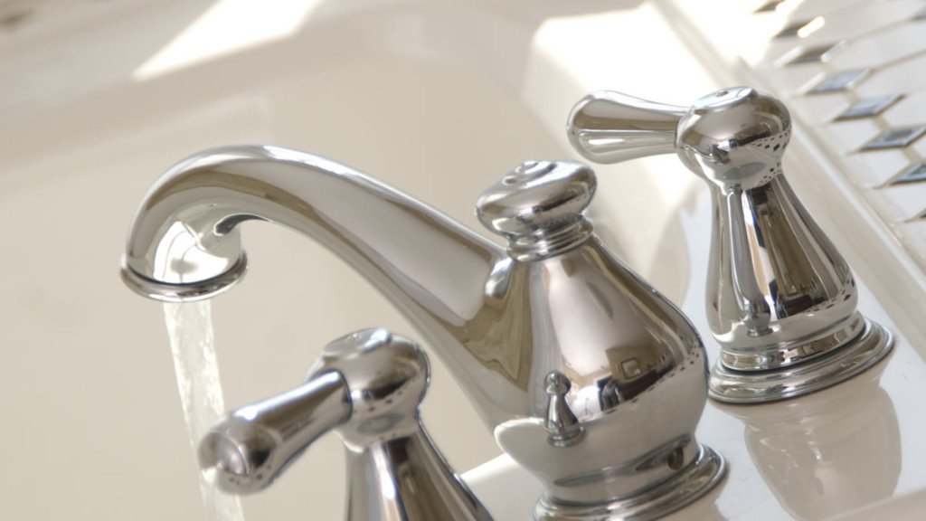 Shiny silver faucet on guest bath sink