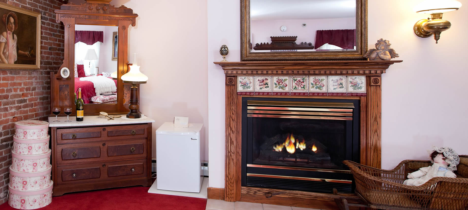 Prince Alfred guest room fireplace with wall mirror and dresser with mirror